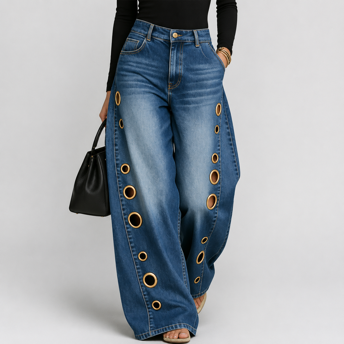 Jeans a gamba larga a vita alta con occhielli